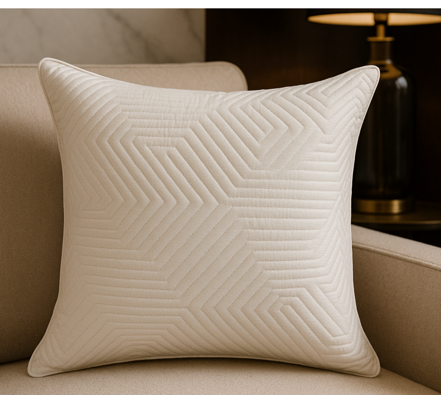 Luminous white quilted cushion cover with beaten gold accents.