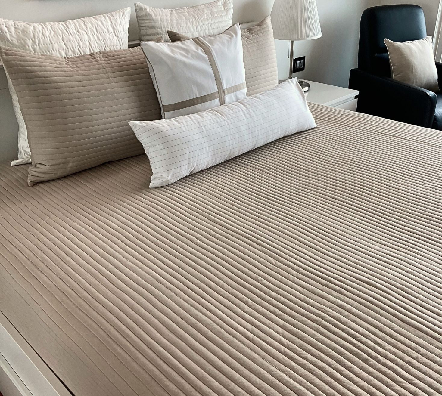 Channel style quilted white and beige patterned bedspread