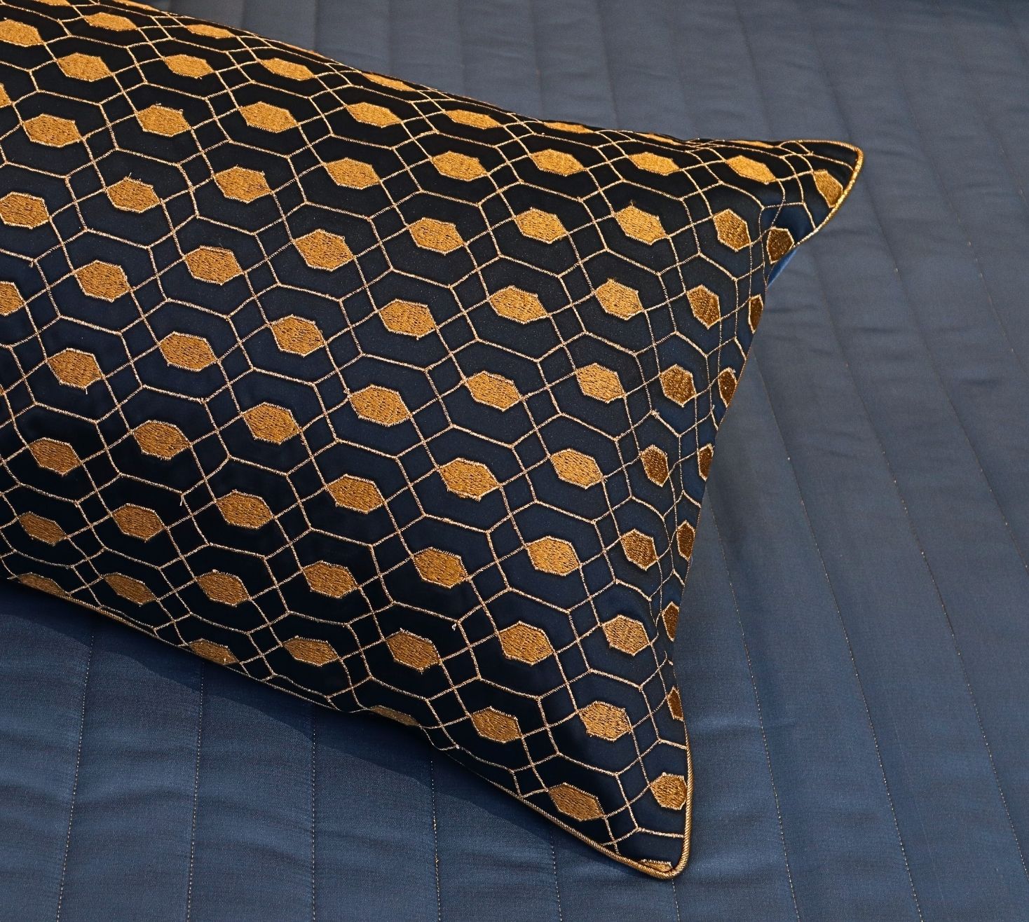 Linear quilted blue and gold satin bedspread