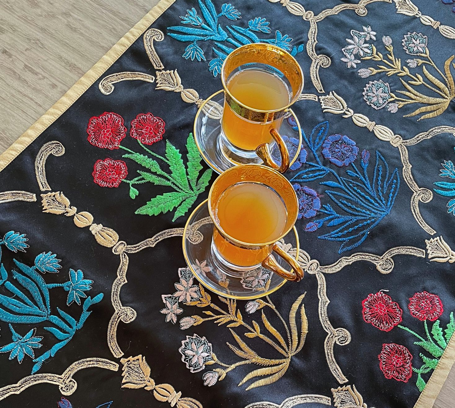 The black Regal bloom multicoloured table runner set